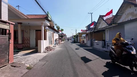 Bright sun shines over quiet village street Stock Footage 345192457