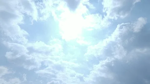 Bright Sun Shines Through White Clouds In A Blue Sky On A Partly Cloudy Day Vídeos de archivo 331947968