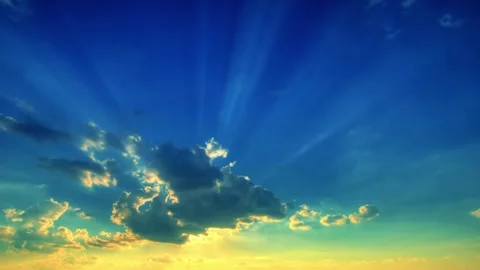 Bright Sun Shining in Blue Sky with Soft Clouds at Sunset or Sunrise Background Video stock 343514420