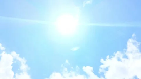 Bright sun shining in clear blue sky with clouds Stock Footage 317021089