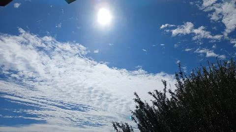 Bright Sun Shining on Textured Cloud Layer 스톡 사진