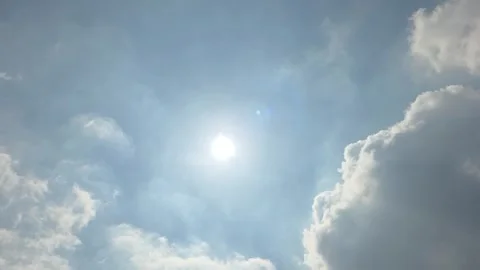 Bright Sun Shining Through Dramatic Clouds with Silver Lining Stock Footage 341621408
