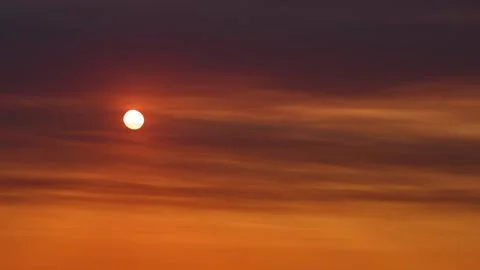 Bright sun shining through thick atmospheric haze and dense smog, time lapse. Stock Photos