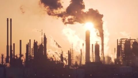 Bright sun sparkling through thick smoke from oil factory Stock Footage 115884616
