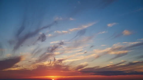 Bright sun at sunset with thin wispy clouds in the sky. Natural landscape view Stock Footage 341855583