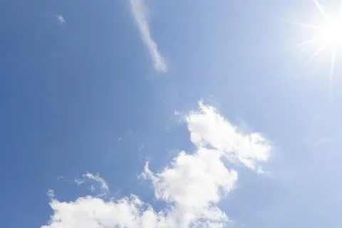 Bright Sun with Thin Wispy Clouds in Blue Sky 写真素材