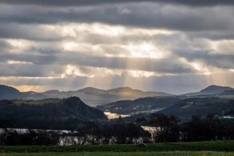 Bright sunbeams shining through clouds Norway Stock Photos