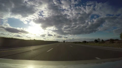 Bright sunburst under the span of an elevated motorway Stock Footage 153261110