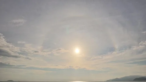 Bright Sundog and Circular Solar Halo Optical Phenomenon in the Sky Stock-Footage 345123339