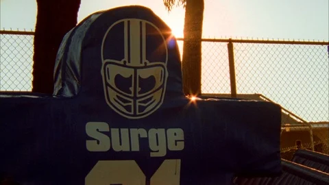 Bright sunlight behind the tackling dummy on the NFL field Stock Footage 113277195