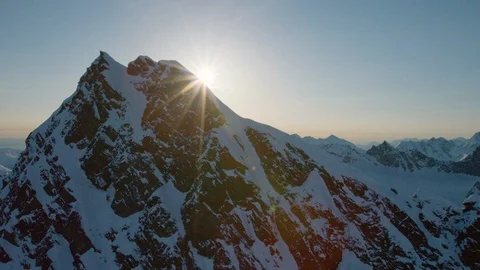 Bright sunlight falling on snow covered mountains Stock Footage 113254165