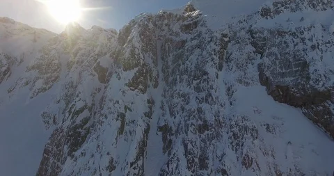 Bright sunlight over the snow covered mountains Stock Footage 108635853