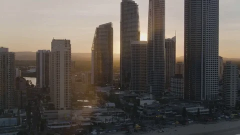 Bright sunlight passing through the city skyscrapers at sunset Stock Footage 81007609