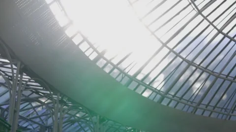 Bright sunlight streaming through the transparent glass roof structure of Opera  Stockbeeldmateriaal 277464263
