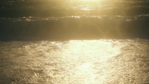 Bright sunlight in a wave on the shore slow motion Stock Footage 82129293