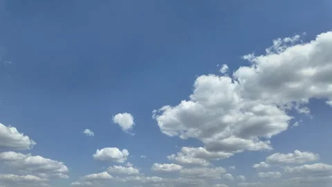 Bright sunny day with white clouds floating timelapse Stock Footage 308090562