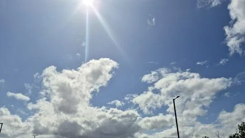 Bright sunny sky with dramatic clouds Stock Photos