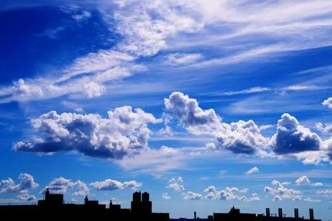 Bright Sunny Sky with Dramatic Clouds Stock Photos
