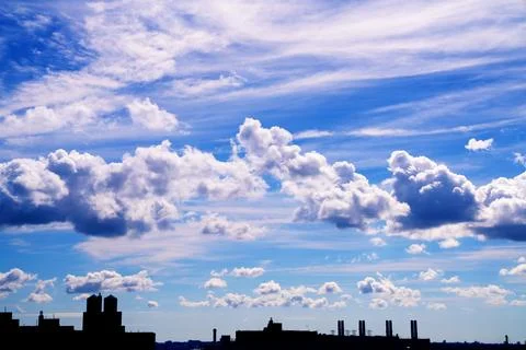 Bright Sunny Sky with Dramatic Clouds Stock Photos