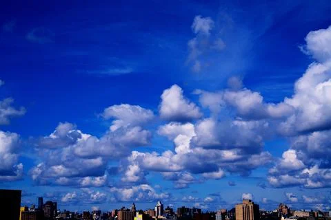 Bright Sunny Sky with Dramatic Clouds Stock Photos