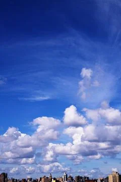 Bright Sunny Sky with Dramatic Clouds Stock Photos