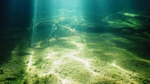 Bright sunrays forming patterns on lake bottom Stock Footage 100307958