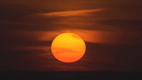 The bright sunset on a night cloud background. time lapse Stock Footage 118885962