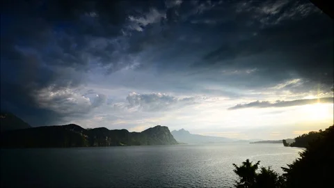 Bright sunset over the Alps mountains. Time lapse. Lake Lucerne. Switzerland Stock Footage 111005913