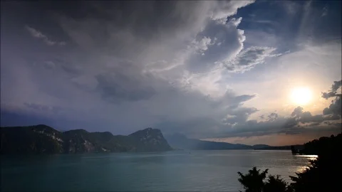 Bright sunset over the Alps mountains. Time lapse. Lake Lucerne. Switzerland Stock Footage 111008031