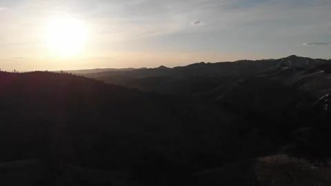 Bright sunset over dark mountains 動画素材 310528123