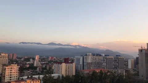Bright sunset over the sea, view of the city from above Stock-Footage 129547173