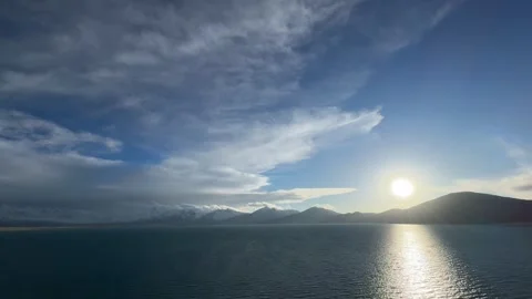 Bright Sunset over Snow-capped Mountains and Sacred Lake in Tibet Stock-Footage 332190502