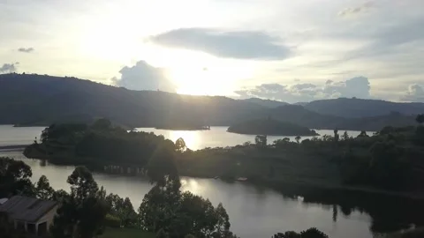 Bright Sunset Reflected Over Lake Bunyonyi In Uganda, Africa. Aerial Drone Stock Footage 239352629