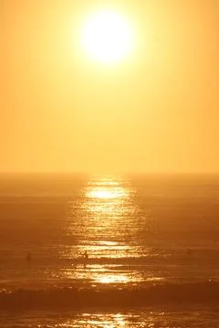 Bright Sunset Reflection over Atlantic Surf in Carcavelos, Portugal Fotos de archivo