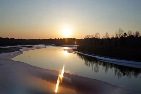 Bright sunset on the river, spring landscape Stock Photos