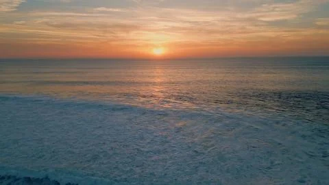 Bright sunset shining sea surface drone view. Stunning summer sun setting down Stock Photos