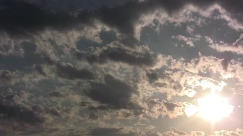 Bright sunset timelapse to low right corner w cloud texture motion to pastels Stock Footage 240507911