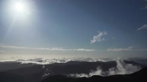 Bright sunshine bubbling up cumulus cloud in a mountain landscape 스톡 동영상 142578680