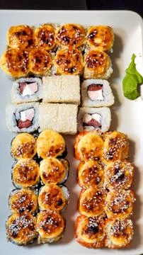 Bright sushi sets as background, top view, close-up Stock Photos