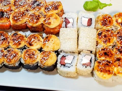 Bright sushi sets as background, top view, close-up Stock Photos