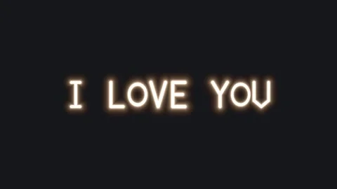 Bright text displays a love message in dark background Stock Footage 339324423