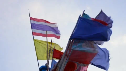 Bright Thailand national flag and colorful flags waving on a fishing boat under Stock Footage 314302053