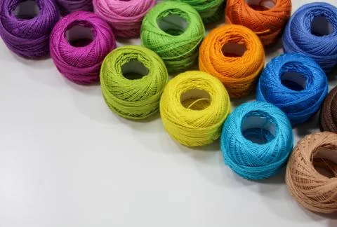 Bright threads in multi-colored skeins for crocheting. Stock Photos