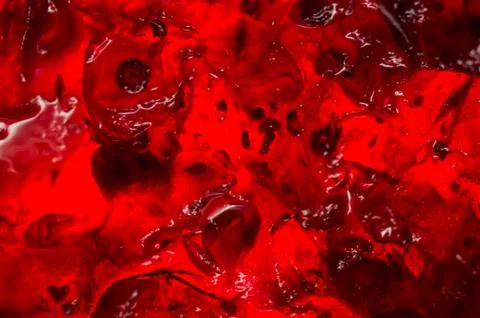 Bright translucent red currant jam in a glass jar Foto stock