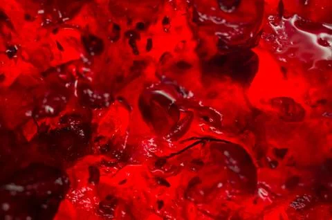 Bright translucent red currant jam in a glass jar Stock Photos