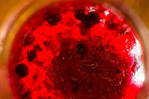 Bright translucent red currant jam in a glass jar Stock Photos