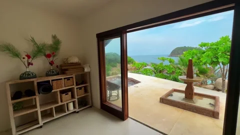Bright tropical architecture interior with open terrace and ocean view Stock Footage 327517898