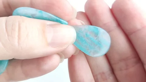 Bright turquoise amazonite gemstone teardrop pendant Stock Footage 345139499