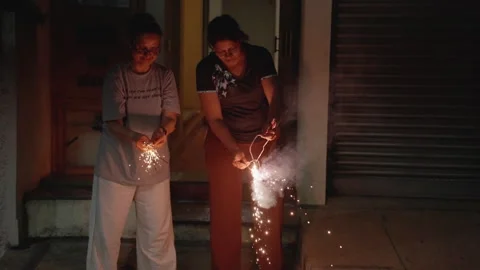 Bright Twinkling Star Firecracker: Slow Motion Nighttime Celebration Stock-Footage 332470213