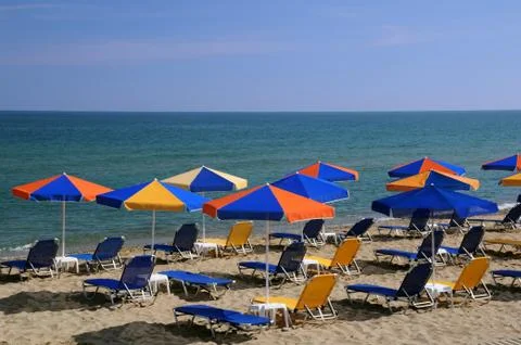Bright umbrellas on the beach Stock Photos